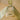Decorative item with a green ribbon and intricate design on a beige background