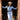 Woman in cowboy hat and blue denim outfit standing in a doorway.
