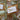 Decorative cards with green ribbons on a wooden surface