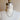 Mannequin bust with a necklace on a plain background