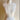Mannequin torso with a long necklace on a plain background