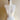 Mannequin torso with sewing lines on a plain background