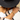 Woman in a black hat wearing stacked Alex gemstone bracelets