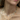Close-up of the Bennett gray and white pearl necklace layered with the Stevie and Huntleigh necklaces