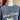 Blondie horseshoe necklace worn over a blue crewneck sweatshirt on a dress form