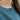 Close-up of the Carys Sleeping Beauty turquoise drop necklace worn with a teal sweater