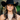 Woman in a black cowboy hat wearing large pearl and turquoise stone necklaces layered together