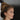 Profile of a woman with her hair in an updo wearing large EV 14k gold filled threader hoops