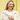 Smiling woman wearing EV gold filled threader hoop earrings with a necklace stack