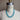 Turquoise beaded necklace on a mannequin with 'Wolf Form Co.' label.