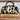 Leopard print handbag on a book with a framed landscape painting in the background
