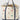 A cream canvas tote bag with navy blue trim and handles, decorated with embroidered Western-themed motifs including horseshoes, a longhorn, a cactus, a cowboy hat, and a car. The bag is filled with straw and metal horseshoes, set against a clean white background.