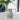 Silver pitcher on a table with a blurred background