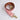 Pink leather strap with gold hardware on a white background