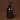 Black hand wash bottle with pump on a brown background