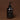 Black hand wash bottle with pump on a brown background