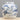 Blue and white ceramic jar with intricate designs on a gray background