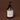 Hand cream bottle with pump on a brown background