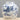 Ceramic jar with blue and white dragon design on a gray background