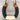 A horseshoe-shaped necklace or pendant featuring dark gray wool wrapped sections, a cream-colored knit band at the bottom, and natural brown wooden ends, suspended from black cords on a weathered gray wood background.