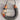 A handmade U-shaped necklace featuring a thick, textured dark gray wool wrap, natural brown wooden ends, a rustic beige twine band, and a small feather accent with red and orange tips, suspended on a gray wood plank background.