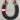 Decorative horseshoe with yarn wrapping and leather straps on a wooden surface