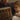 Person reading a colorful children's Bible to a child on a couch.