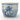 A vintage blue and white ceramic planter pot featuring hand-painted floral motifs, a Greek key border, and a landscape design on a light gray background.