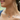 Smiling woman in a navy ribbed tank wearing the Wayne turquoise station necklace