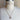 Maisie pearl and cross coin necklace shown at 16–18" on a dress form